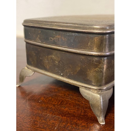 39 - An early 20th century silver and tortoiseshell pique jewellery box, Birmingham 1925, with inlaid top... 