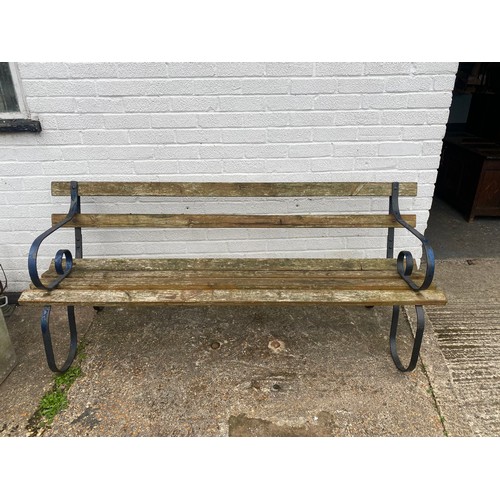 403 - A garden bench with scrolled arm support -