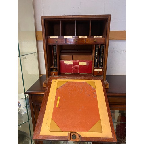 47 - An early 20th century table top stationery cabinet, the front with inlaid decoration and opening to ... 