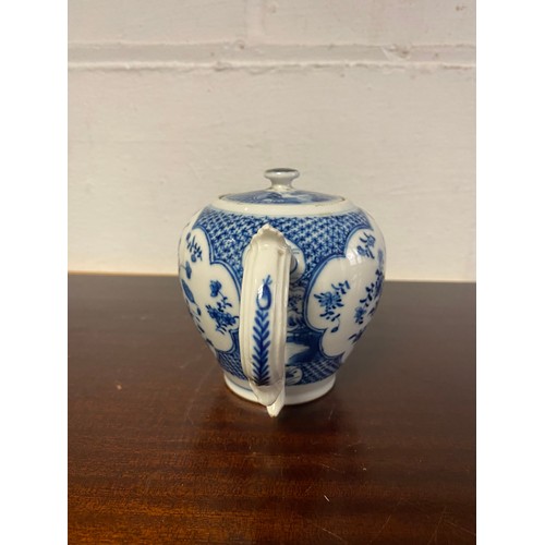 91 - A late 18th/early 19th century blue and white teapot and cover, painted with panels of flowers -