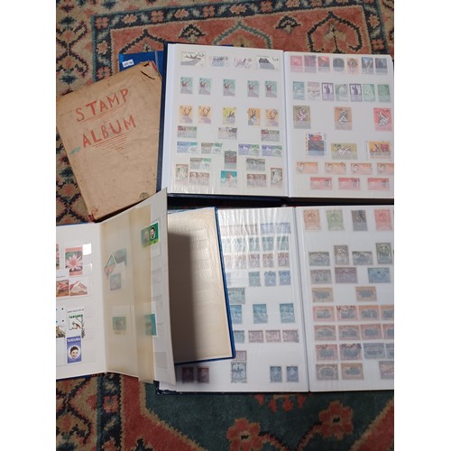 215 - Stamps: four World stock books and a similar album -