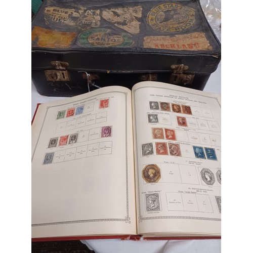 222 - Stamps: an Ideal stamp album of GB and World stamps, in a vintage suitcase -