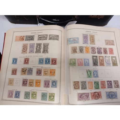 222 - Stamps: an Ideal stamp album of GB and World stamps, in a vintage suitcase -