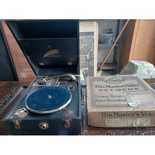 168 - An HMV gramophone and a box of records -