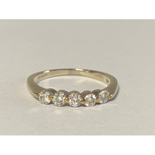 15 - A diamond five stone ring, set in 18ct gold -