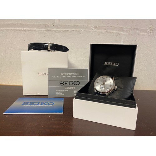 20 - A contemporary Seiko Presage Cocktail automatic watch, with additional strap, booklets and boxes -