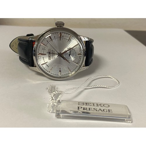 20 - A contemporary Seiko Presage Cocktail automatic watch, with additional strap, booklets and boxes -