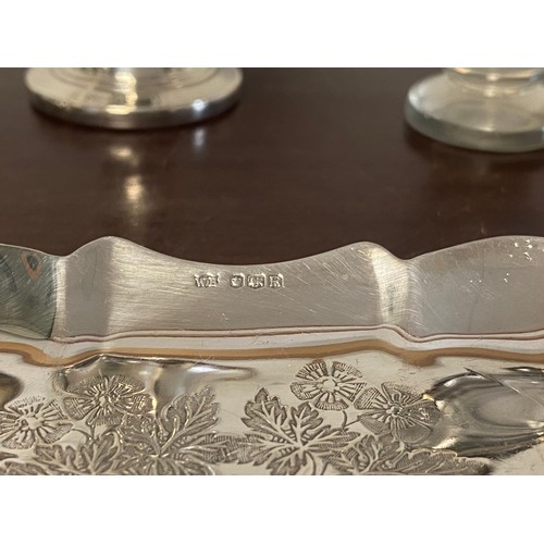 5 - A mid century silver dish, Sheffield 1959, with shaped outline and engraved with floral decoration, ... 