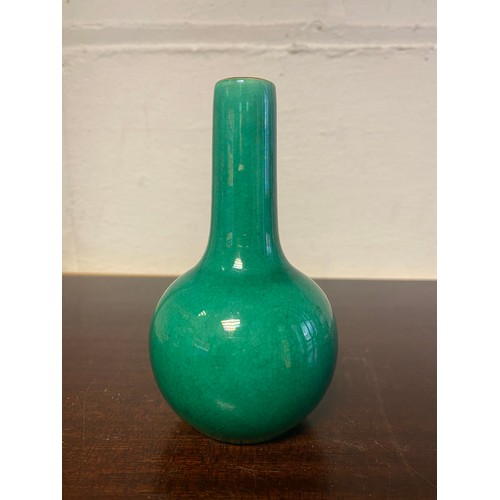 115 - A Chinese green glazed bottle vase -