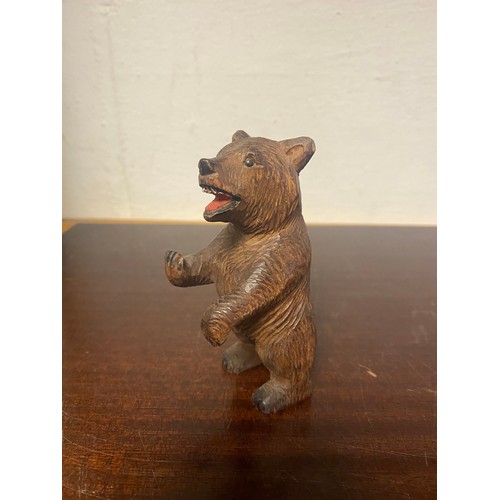 95 - A carved Black Forest bear, with carved and stained open mouth and eyes -