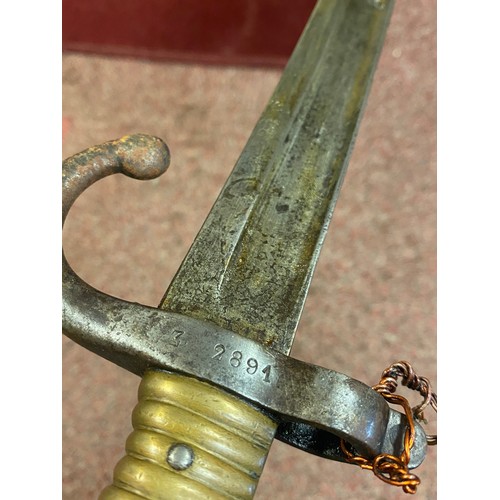 430 - A late 19th century bayonet, with brass grip, stamped Z 2891 to hilt, the blade also stamped, with s... 