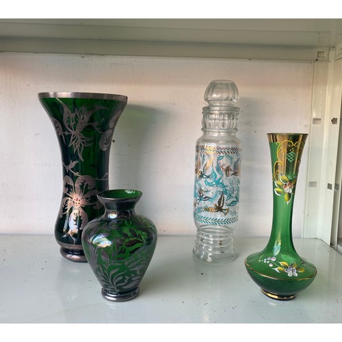 133 - An overlaid green glass vase, another smaller, a green enamelled vase and a jar (4) -