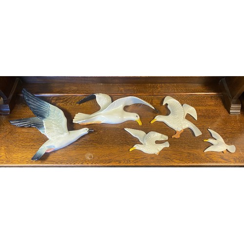 138 - A Beswick seagull, model 658-1, together with another set of three seagulls, three mallard ducks etc... 