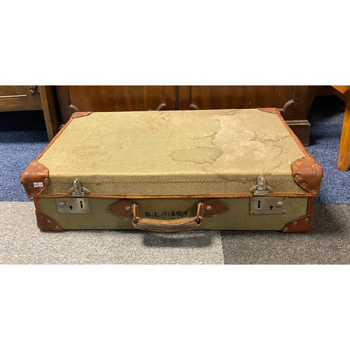 422A - A leather bound canvas suitcase, with military markings -