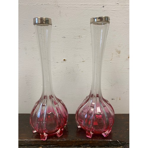 11 - A pair of silver collared cranberry glass vases -