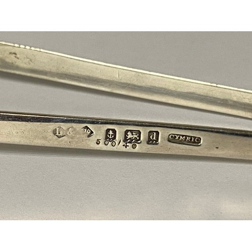 50 - Liberty & Co: a pair of silver 'Cymric' sugar tongs, Birmingham 1903 -