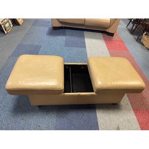 410 - An Ekornes Stressless sofa and matching footstool -