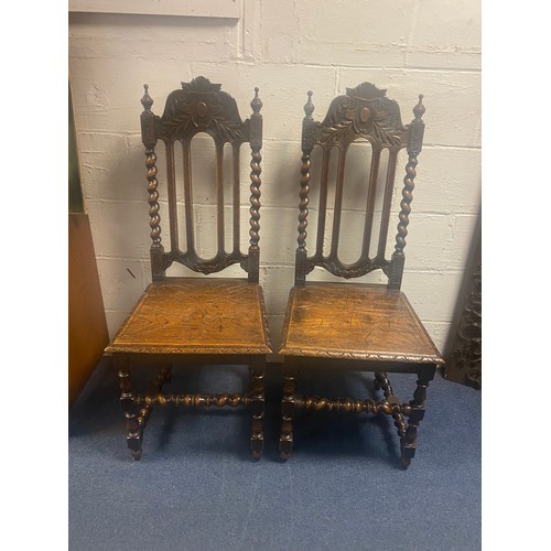 427 - A pair of 17th century style oak high back chairs -