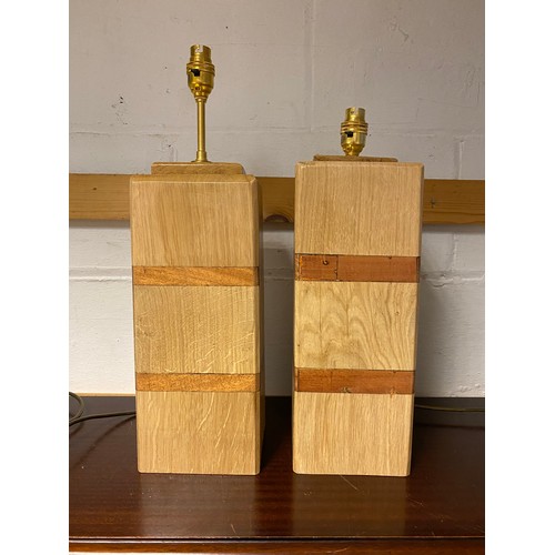 428 - A pair of modern wooden based table lamps -