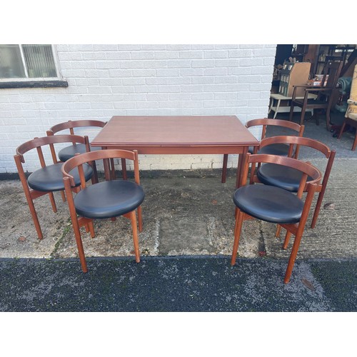 443 - A Danish mid century extending dining table with six chairs -