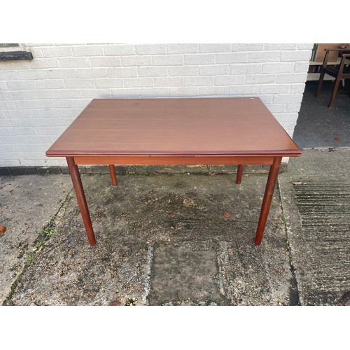 443 - A Danish mid century extending dining table with six chairs -