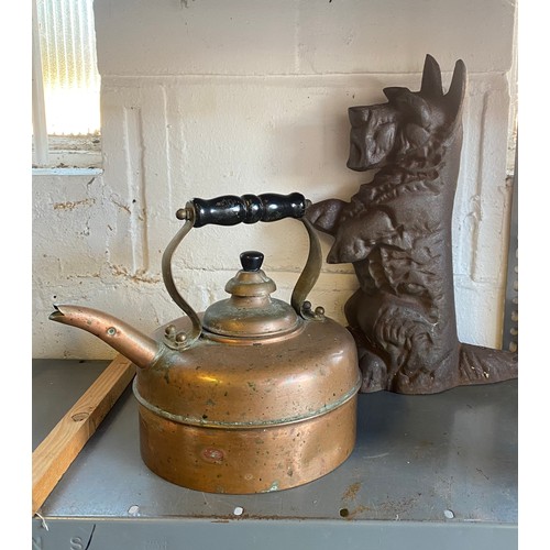 466 - A cast iron doorstop, in the form of a terrier and a copper kettle -