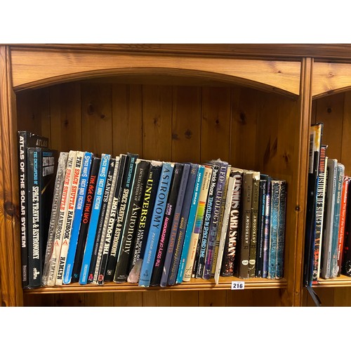 216 - Two shelves of books, mostly of astronomy and space interest -