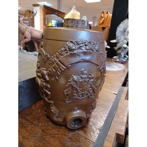 468 - A Victorian stoneware spirit barrel, with coat of arms flanked by knight on horseback -