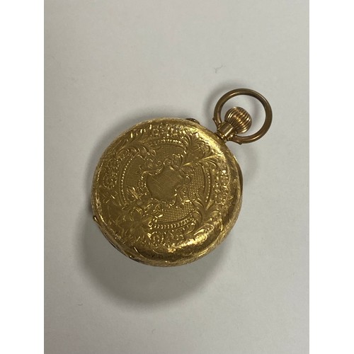 3 - An 18ct gold open face fob watch, the dial with Arabic markers and gilt highlights -