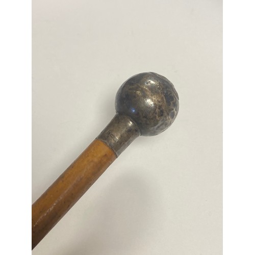 234 - A silver mounted swagger stick, the handle with regimental crest -