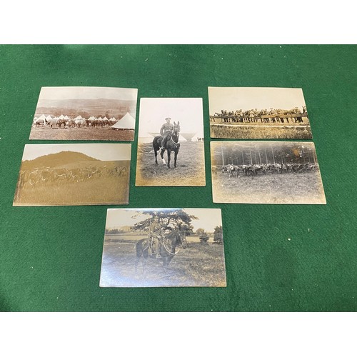 235 - Postcards: a group of six early 20th century military interest photographic postcards, including one... 