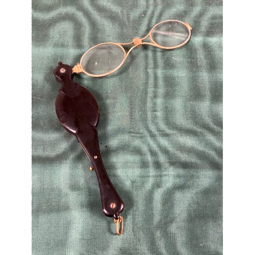 237 - A pair of antique tortoiseshell folding spectacles -