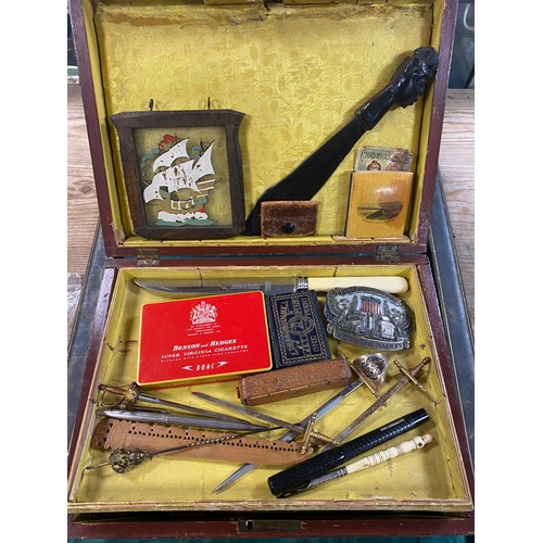 262 - A 19th Century jewellery box and assorted contents, to include a small silver sword, Mauchlineware, ... 