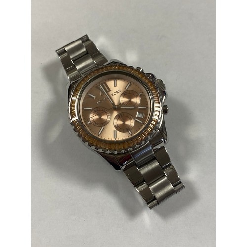 10 - A lady's wristwatch, signed Michael Kors, with baton markers and subsidiary dials -