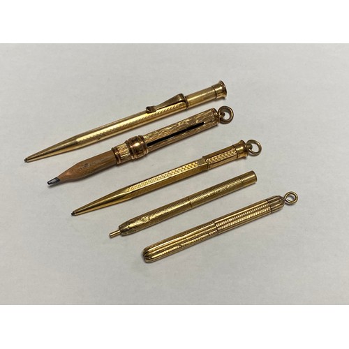 11 - A group of five gold filled and other pencils -