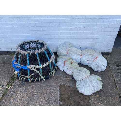 464 - A lobster pot and fishing nets -