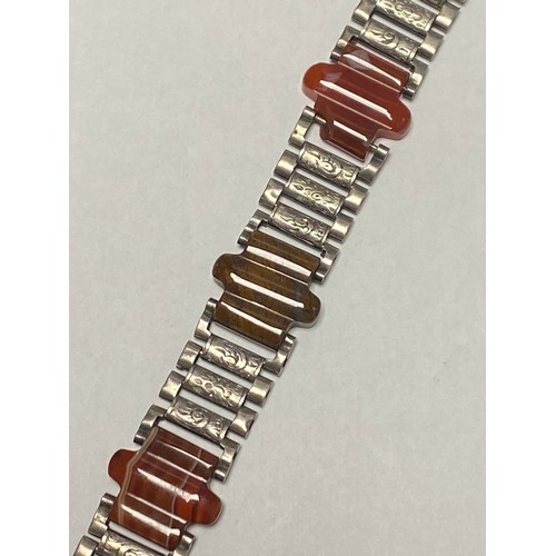 45 - A Victorian silver and agate bracelet, probably Scottish, composed of flexible engraved links and th... 