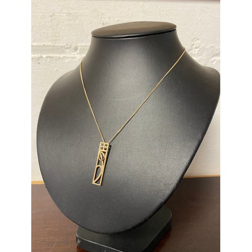 46 - A 9ct gold pendant, in the style of C R Macintosh, to 9ct gold chain -