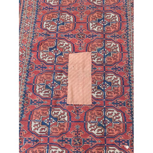 392 - An Eastern rug, approximately 191cm x 112cm -