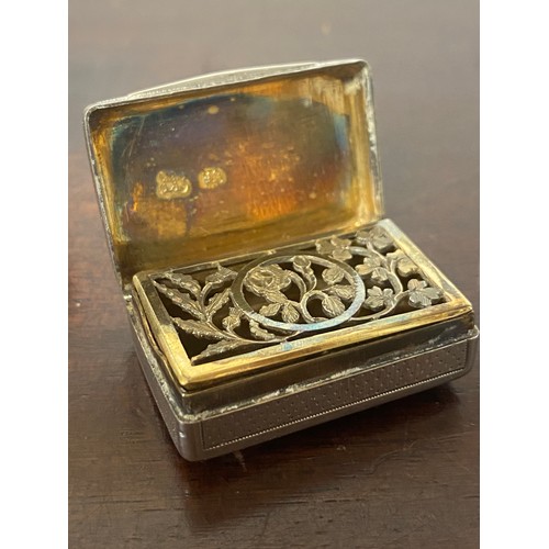 79 - A George III silver vinaigrette, London 1801, together with a cylindrical silver pot and cover (2) -