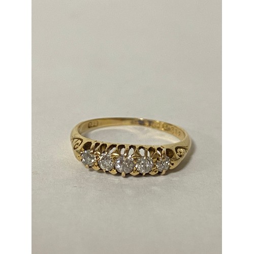 86 - A diamond five stone ring, set with graduated old cut diamonds, in pierced 18ct gold mount -