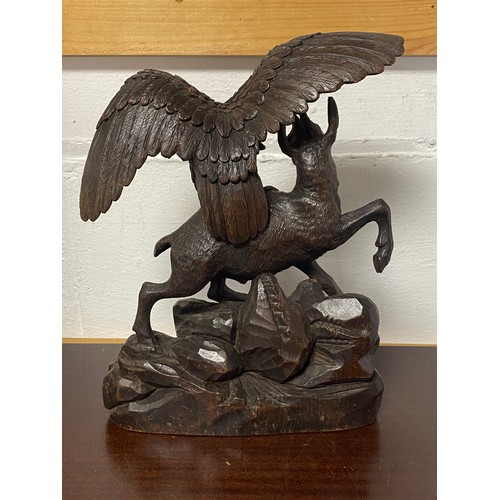 150A - A Black Forest carving, depicting an eagle and goat -