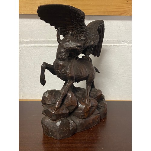 99 - A Black Forest carving, depicting an eagle and goat -