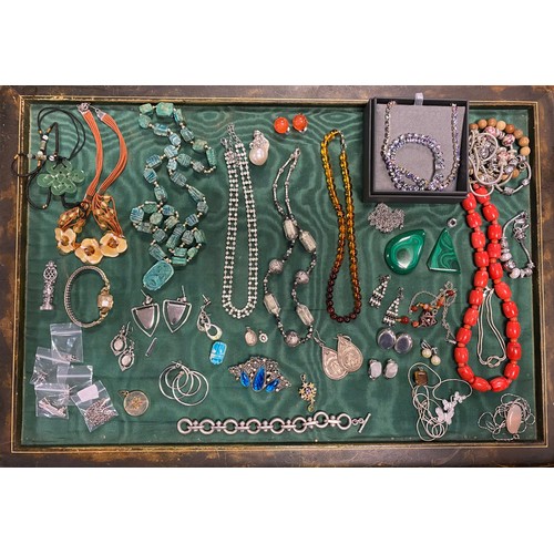 24 - A quantity of silver and costume jewellery, including 925 stamped bracelet, scarab necklace, coral b... 