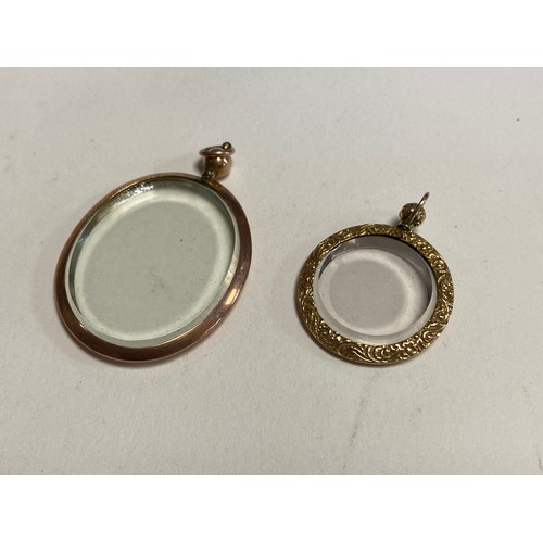 38 - A 19th century 9ct gold locket pendant, with bevelled glass and another circular with repousse decor... 