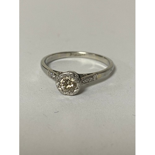 42A - An early 20th century diamond single stone ring, illusion set in 18ct white gold, with diamond accen... 