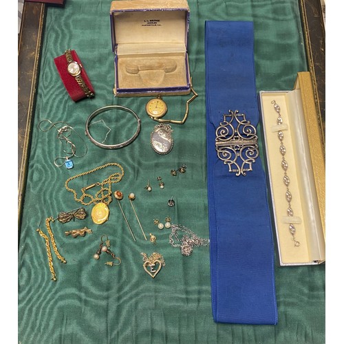 53 - A quantity of silver and costume jewellery, to include nurses buckle, locket on chain, modern bracel... 