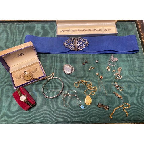 53 - A quantity of silver and costume jewellery, to include nurses buckle, locket on chain, modern bracel... 