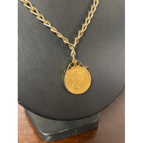 59 - A 1958 Sovereign, in 9ct gold pendant mount, to plated chain -