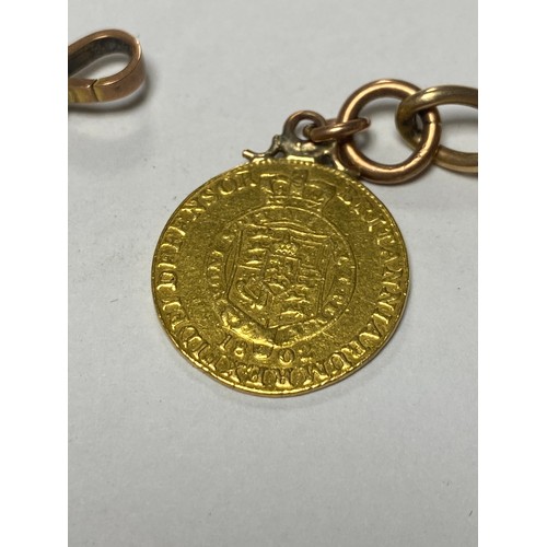 60 - A yellow metal chain, with 9ct gold dog clip, suspending an 1802 George III half guinea and two othe... 